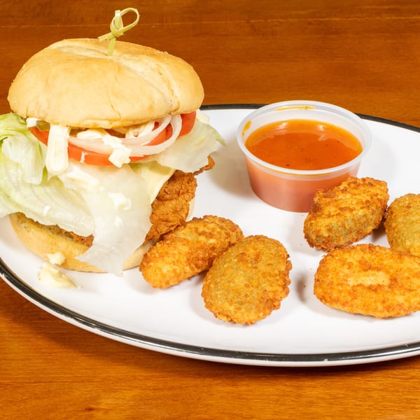 Crispy chicken sandwich with lettuce, tomato, onion, and mayonnaise, served with fried jalapeno poppers and dipping sauce.